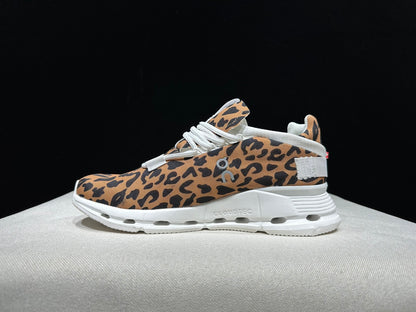 Women's leopard-print mesh lace-up sneaker with a white cushioned sole