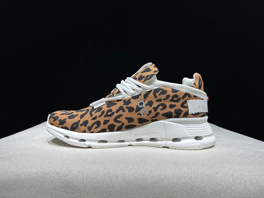 Women's leopard-print mesh lace-up sneaker with a white cushioned sole
