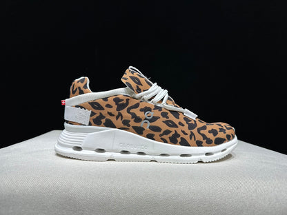 Leopard-print low-top sneaker shown from an alternate side angle